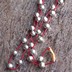 Parad Bead Mala for wearing, consisting of 27 Parad Beads with each Parad Bead weighing 5 grams. (Red small crystals used between each Parad Bead). Total weight 145 grams.